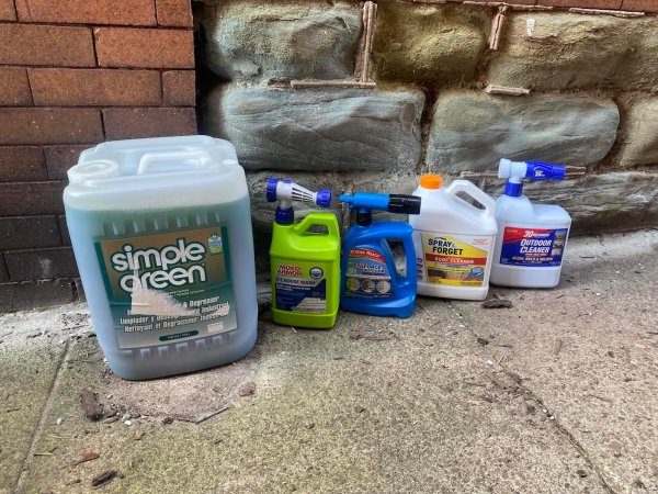 selection of best roof cleaners packages laid out on the floor