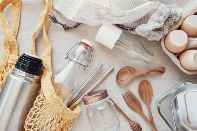 An-assortment-of-sustainable-kitchen-products-sits-on-a-cloth-table.